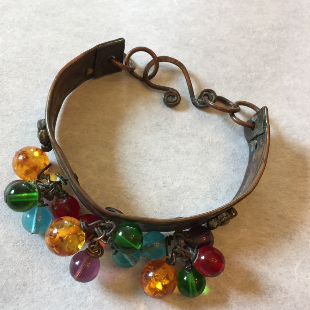 Copper bracelet with mixed colored beads.